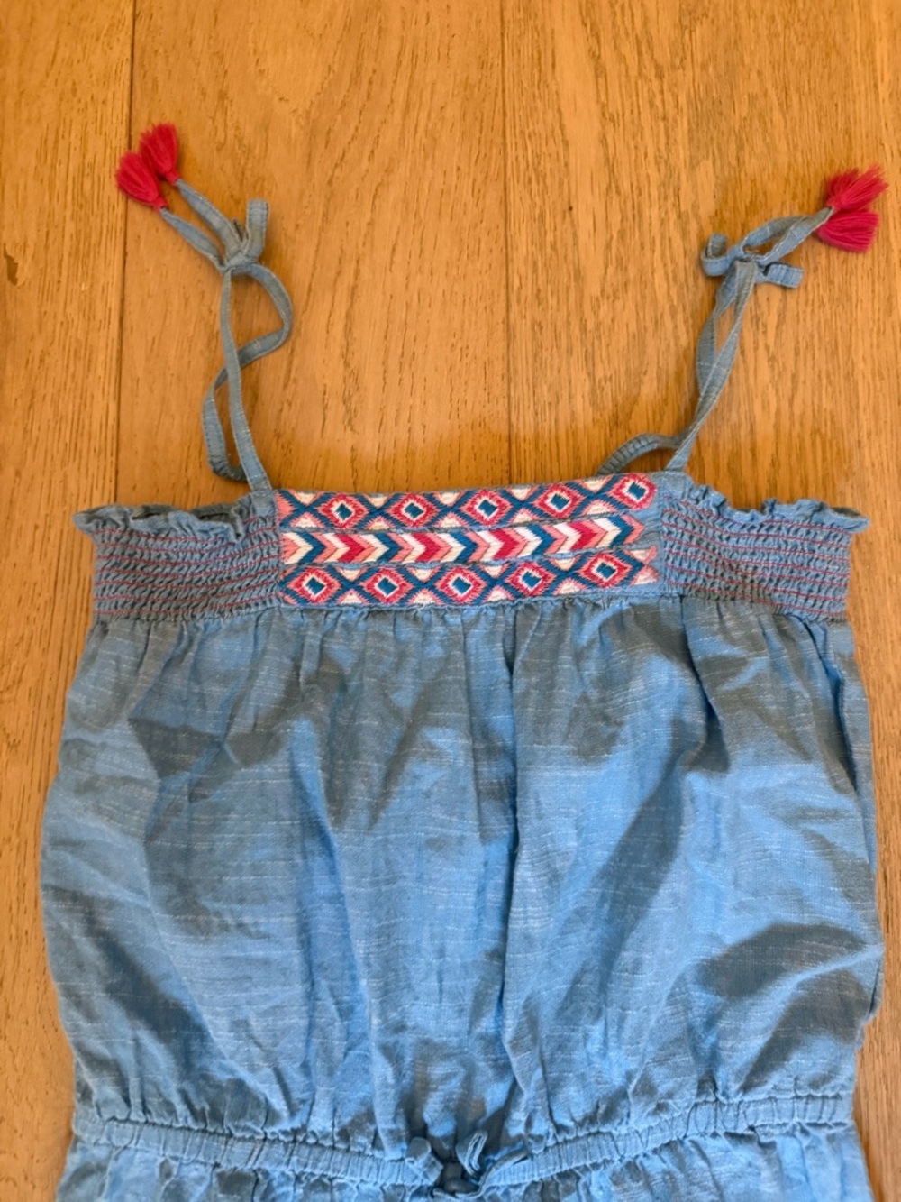 Hatley Blue Chambray Girls' One-Piece Romper with Pink Tassel Accents